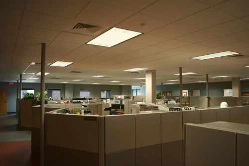 Dimly lit office space with fluorescent lighting prior to using Straits LED lighting fixtures