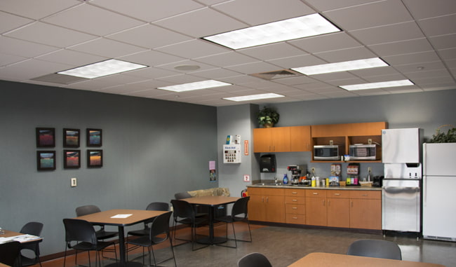 Brightly illuminated office break room after switching fluorescent lights to Straits Tri Line T8 LED Troffer Lights